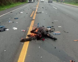 Motorcyclist engulfed in flames after collision with truck