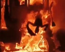 Driver trapped inside burning truck