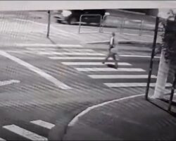 Fatally struck by police motorcycle while crossing the street