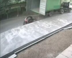 Motorcyclist slammed by container door