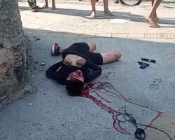 Shot robber dying in agony next to his gun