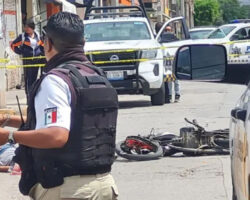 Two young men on motorcycle struck by city public transport bus