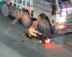 Biker gets trapped between trucks and crushed