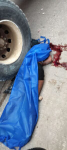 Three on motorcycle struck by garbage truck