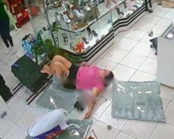 Woman sent flying through store window