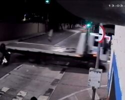 Police officer on motorcycle crashes into truck at full speed