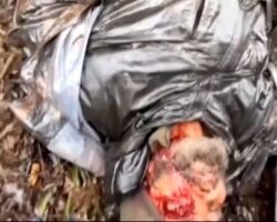 Soldiers providing first aid to their severely wounded comrade