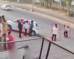 Absent-minded photographer struck by car while working