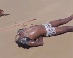 Headless male body discovered on beach