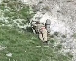 Russian soldier torn into two pieces