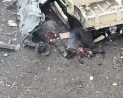Russian soldier unsuccessfully tries to hide from drone behind golf cart