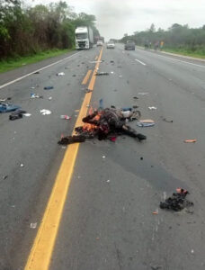 Aftermath of motorcyclist's collision with truck