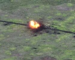 Banknotes spill out of soldier hit by drone #2