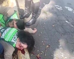 Two police officers struck by van
