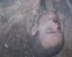 Ukrainian soldiers searching dead body of Russian soldier