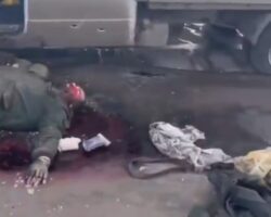 Eliminated Russian soldier next to wrecked van