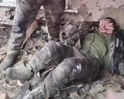Russian soldier mutilates body of dead Ukrainian soldier with axe