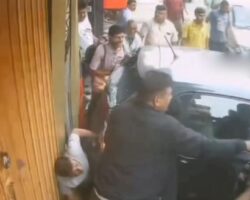 Drunk driver pins man against wall