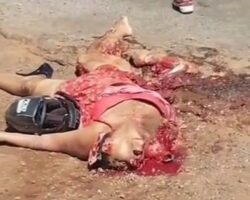 Female motorcycle passenger crushed by truck