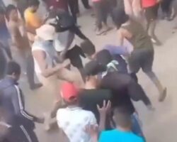Angry mob attacks suspect accused of killing his son
