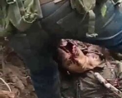 CJNG members mutilate their rival’s body after killing him