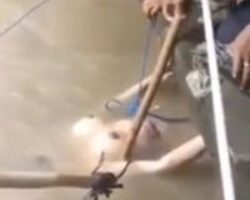 Pulling woman’s naked body out of river #2