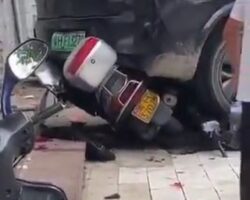 Reversing driver crushes motorcyclist to death against wall