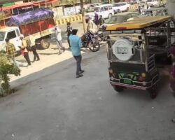 Woman fatally crushed between two trucks