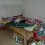 Naked dead Chinese woman in bed