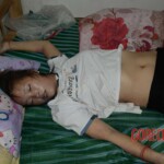 Naked dead Chinese woman in bed