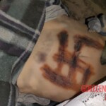 Dead Ukrainian girl with burnt swastika