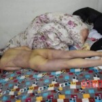 Dead young chinese girl in bed