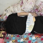 Dead young chinese girl in bed