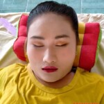 Preparing dead body of woman for burial