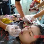 Preparing dead body of woman for burial