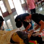 Preparing dead body of woman for burial