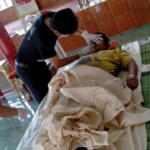 Preparing dead body of woman for burial