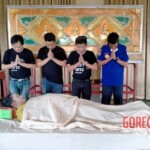 Preparing dead body of woman for burial