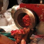Hand in meat grinder