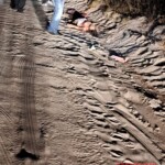 Woman's corpse found on sandy road