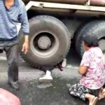 Girl under agitating lorry
