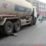 Girl under agitating lorry