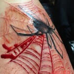 Spider tattoo scarification