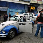 Woman shot dead while travelling in taxi