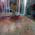 Drug addict tries to break through glass door