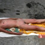 Examination of dead Chinese woman