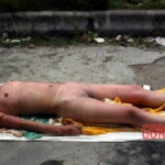 Examination of dead Chinese woman