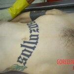 Tattooed woman in morgue