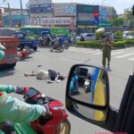 Vietnamese woman on scooter hit & run over by truck