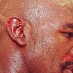 Mike Tyson bites off ear of his opponent Evander Holyfield